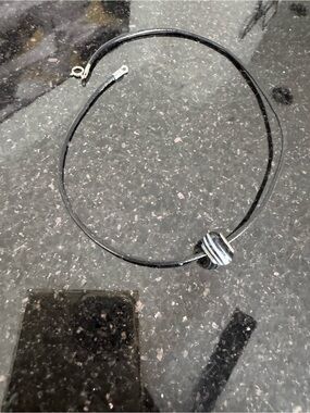 Black Leather Choker with Striped Glass Bead comes with another bead